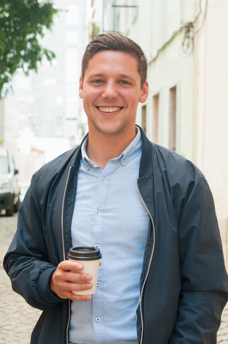 files/cheerful-guy-enjoying-outdoor-coffee-break_1262-20005_jpg.avif